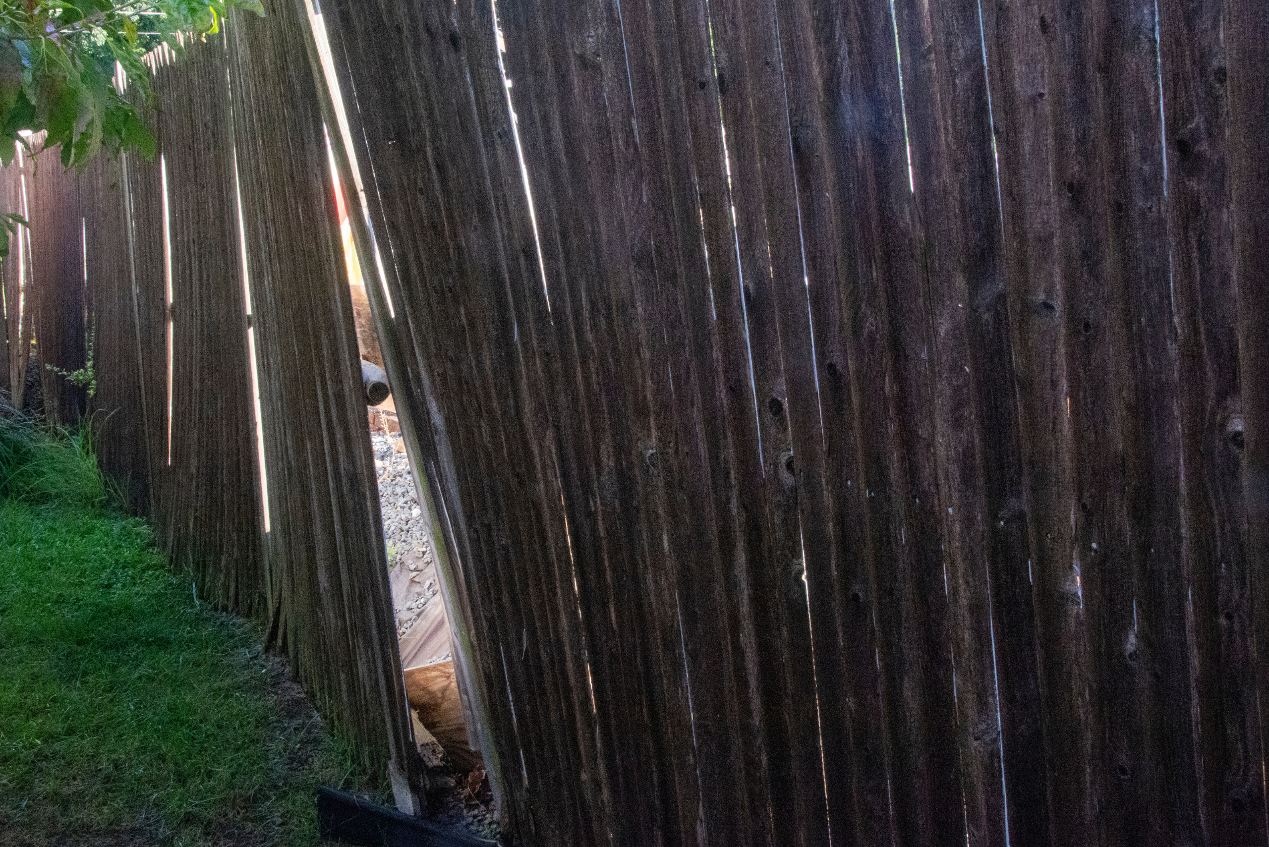 A fence made of wood falling apart.