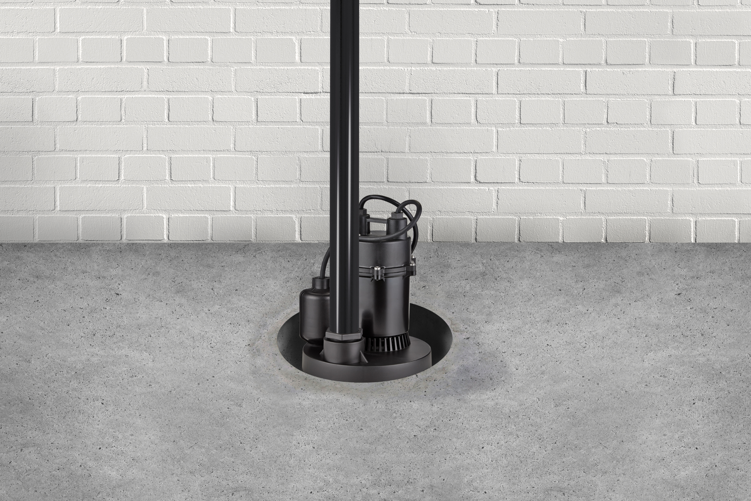 Black sump pump installed in concrete flooring.