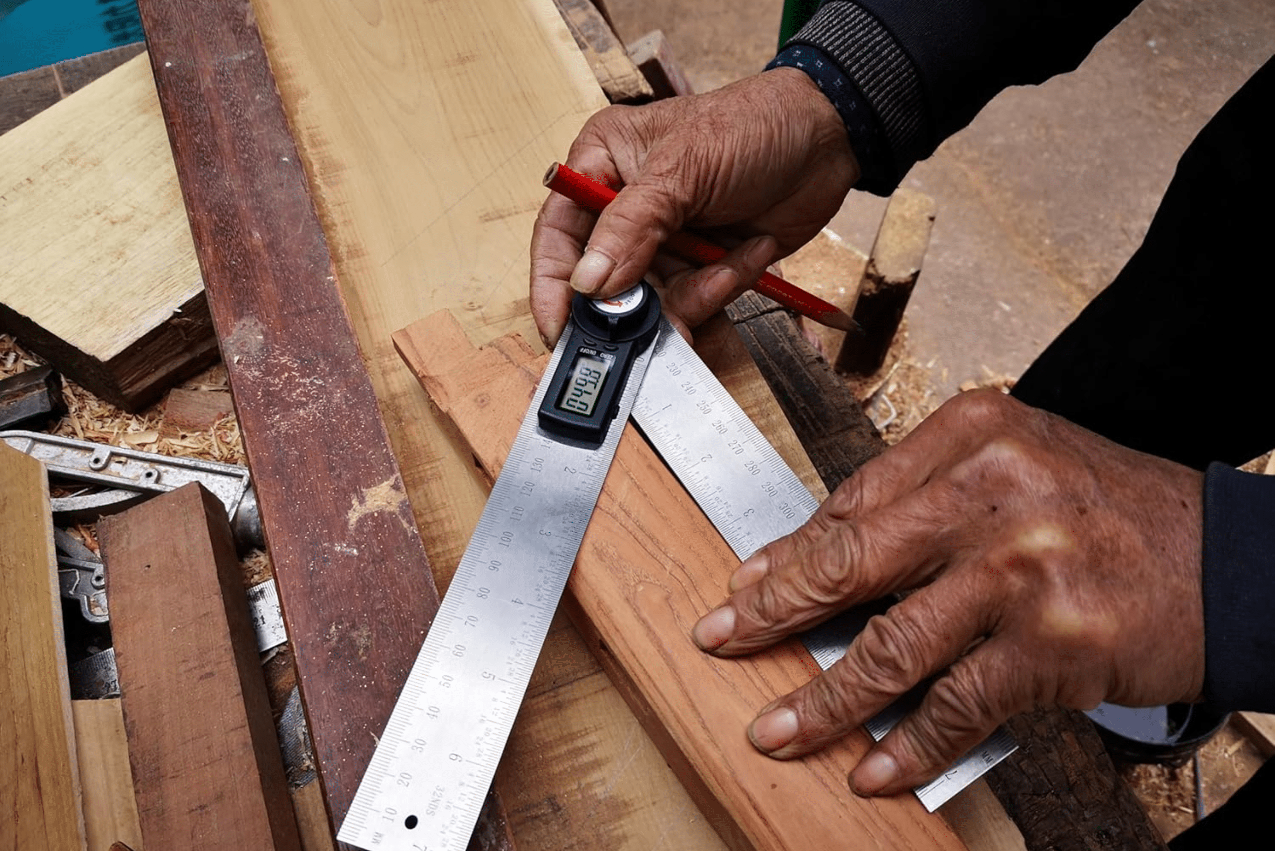 Digital angle finder being used on wood.