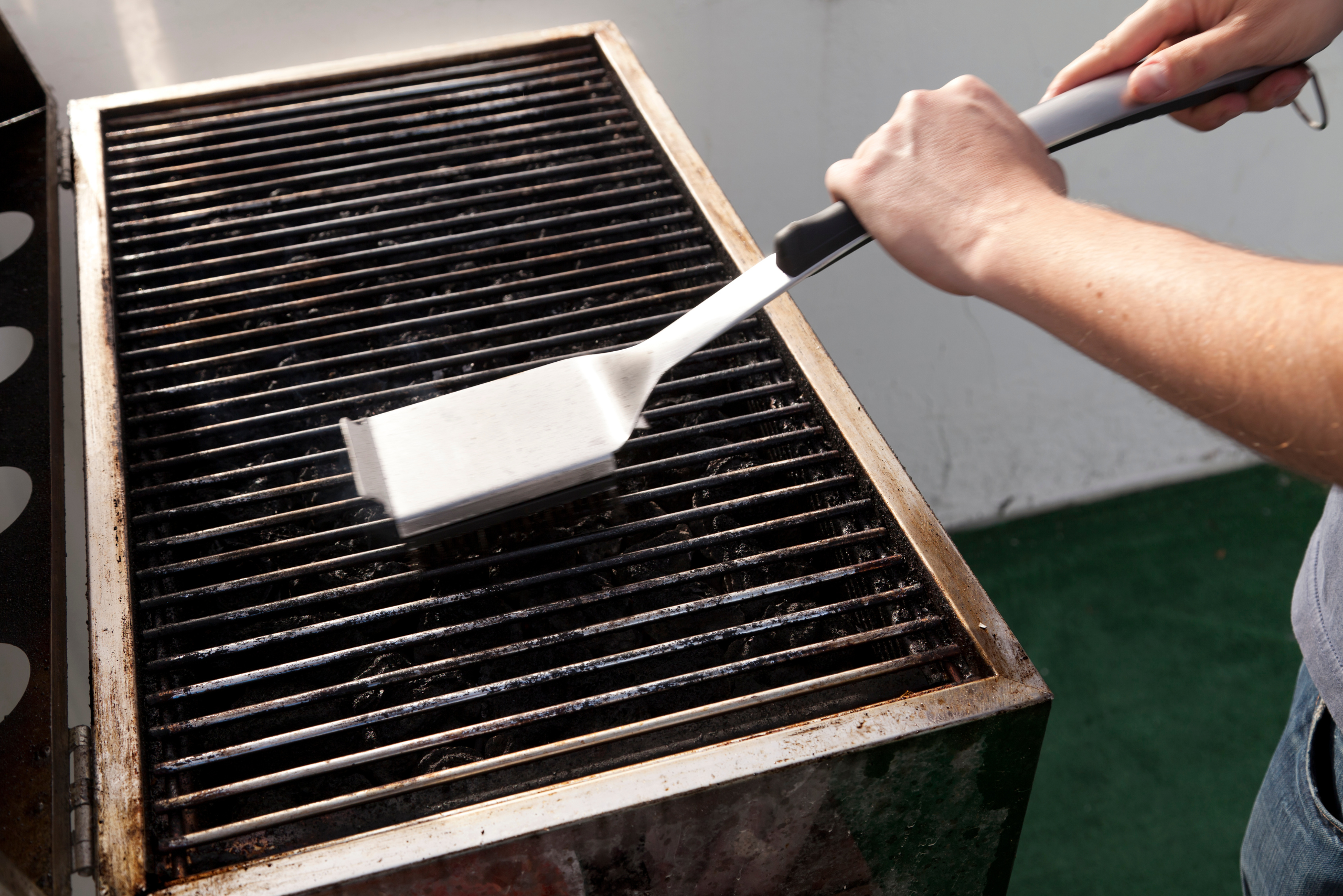 Stainless steel brush on grill of a BBQ