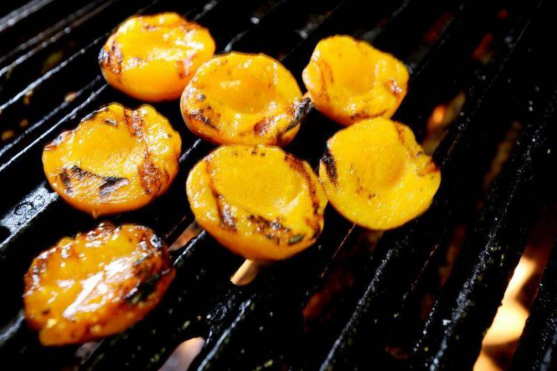 Peaches on a grill.