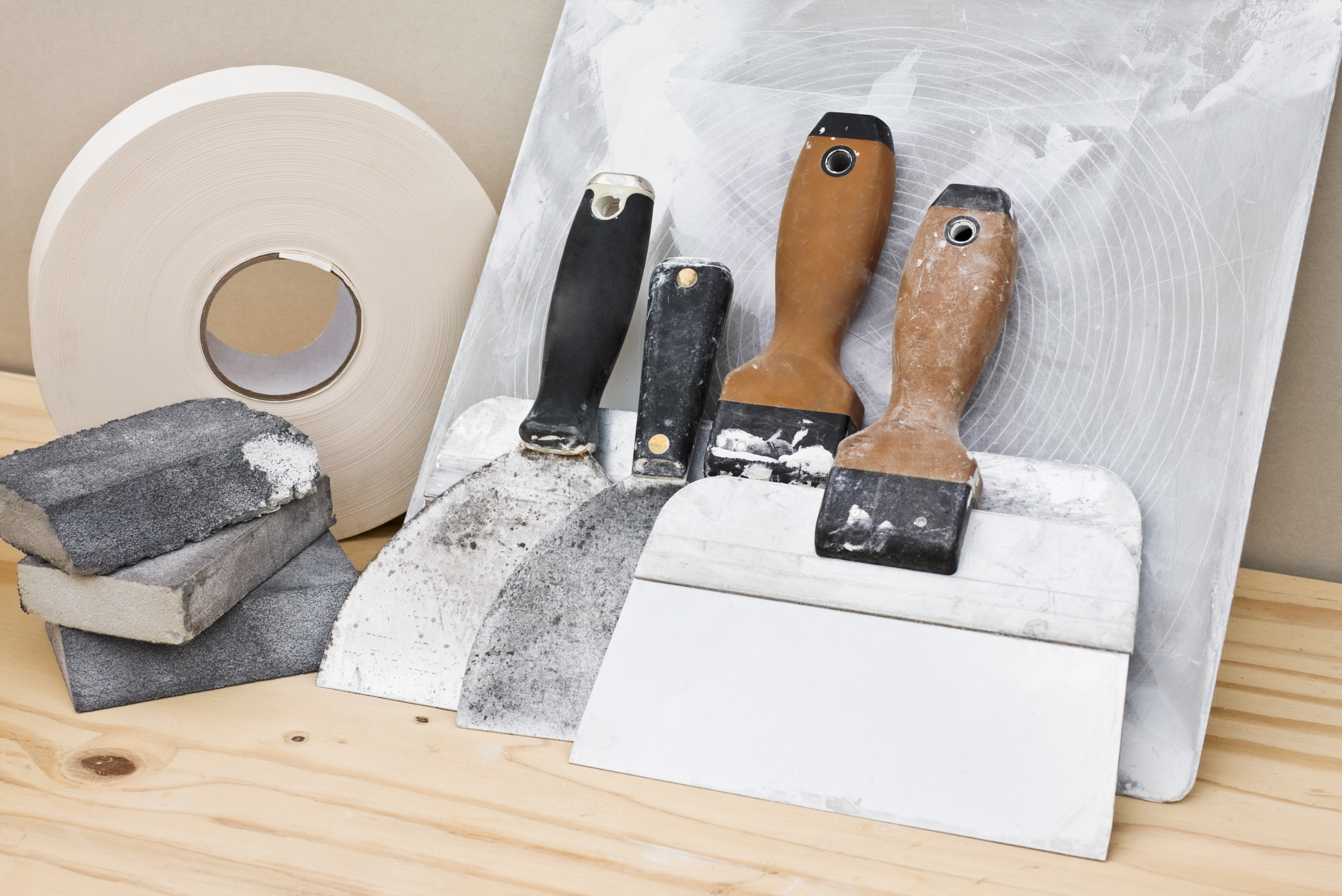 Assortment of tools for drywall hole repairs.