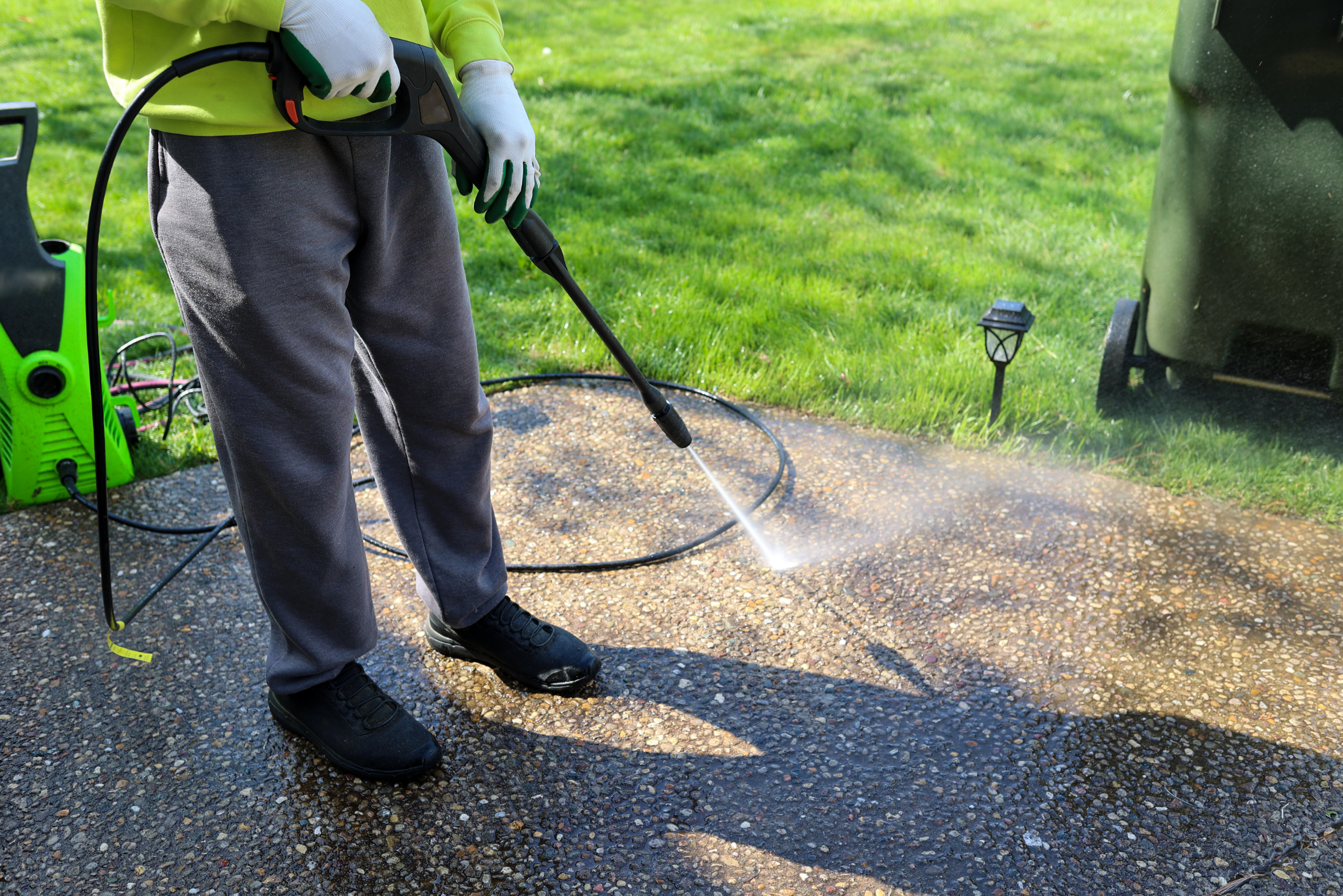 Pressure washing driveway.