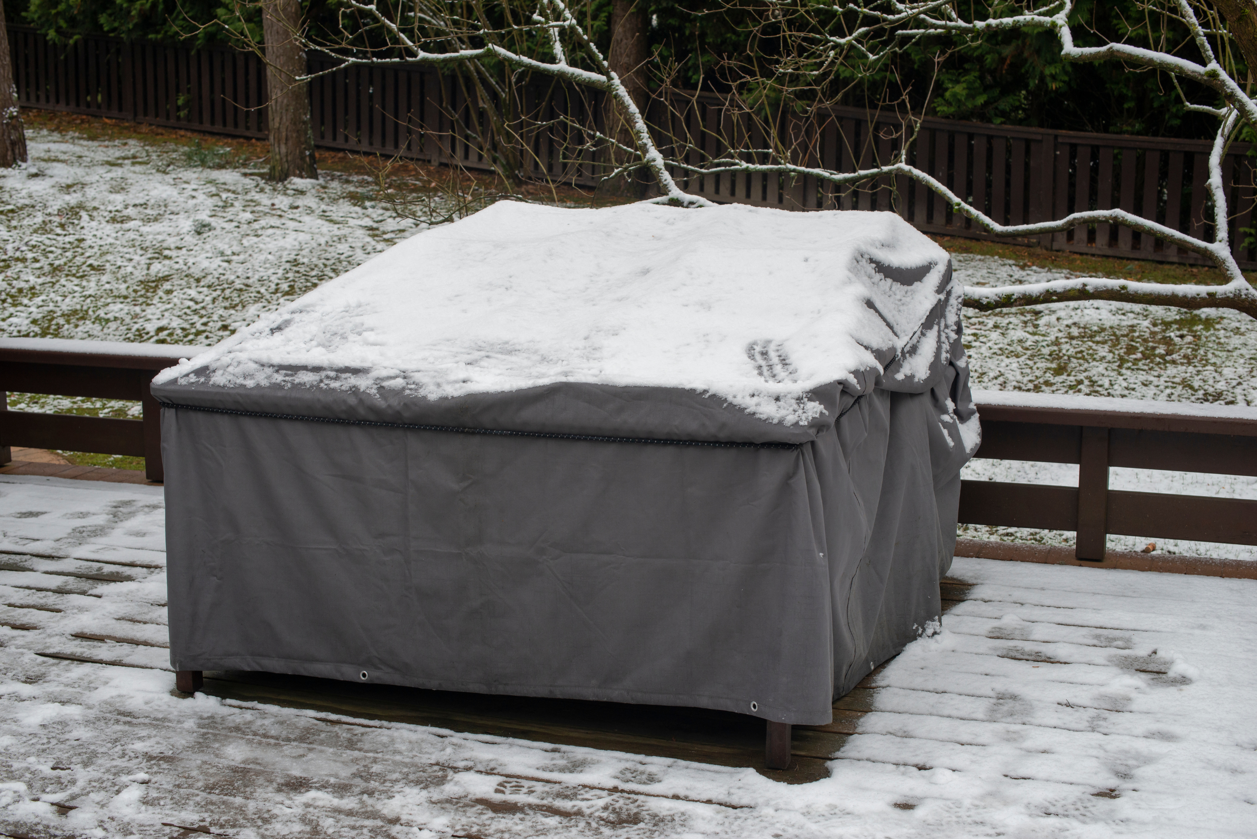 Covered patio furniture during winter.