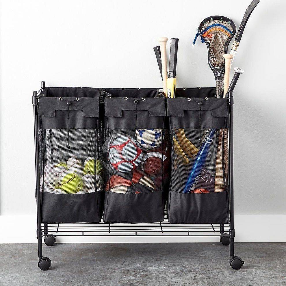 Rolling storage bin full of sports equipment.