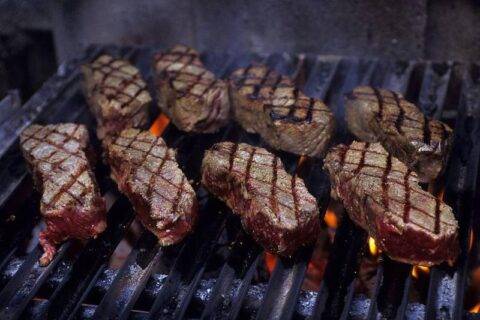 Steaks on grill.