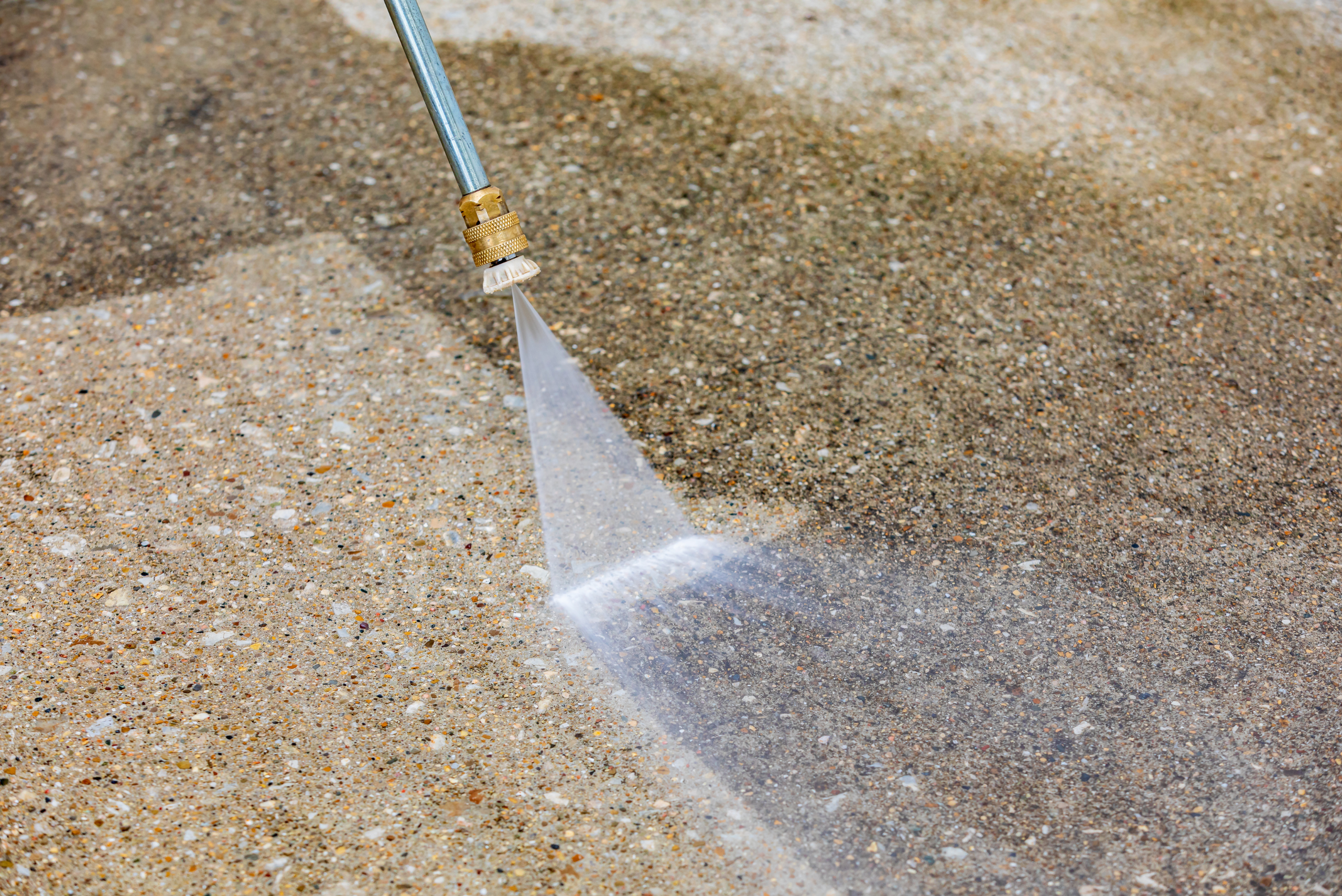 Pressure washing concrete driveway