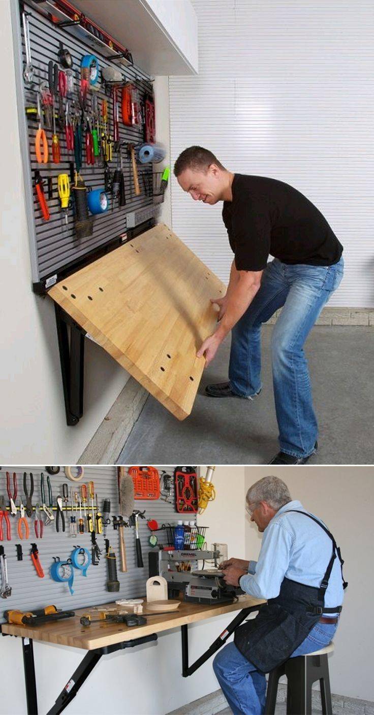 Man folding down a work table.