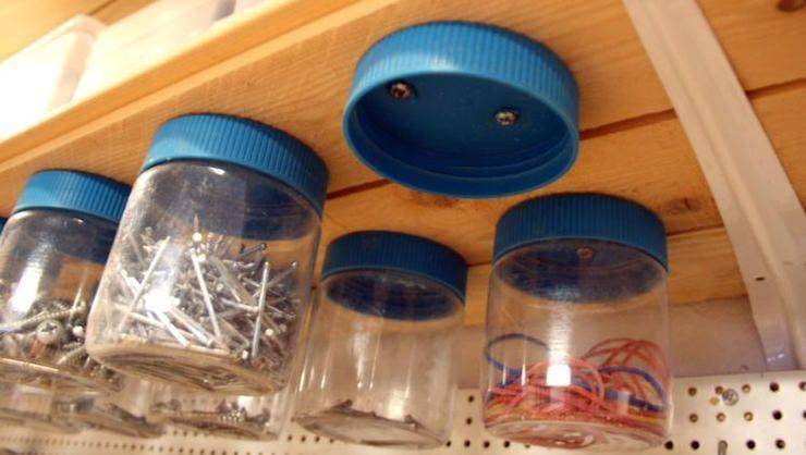 Jars mounted under shelf.