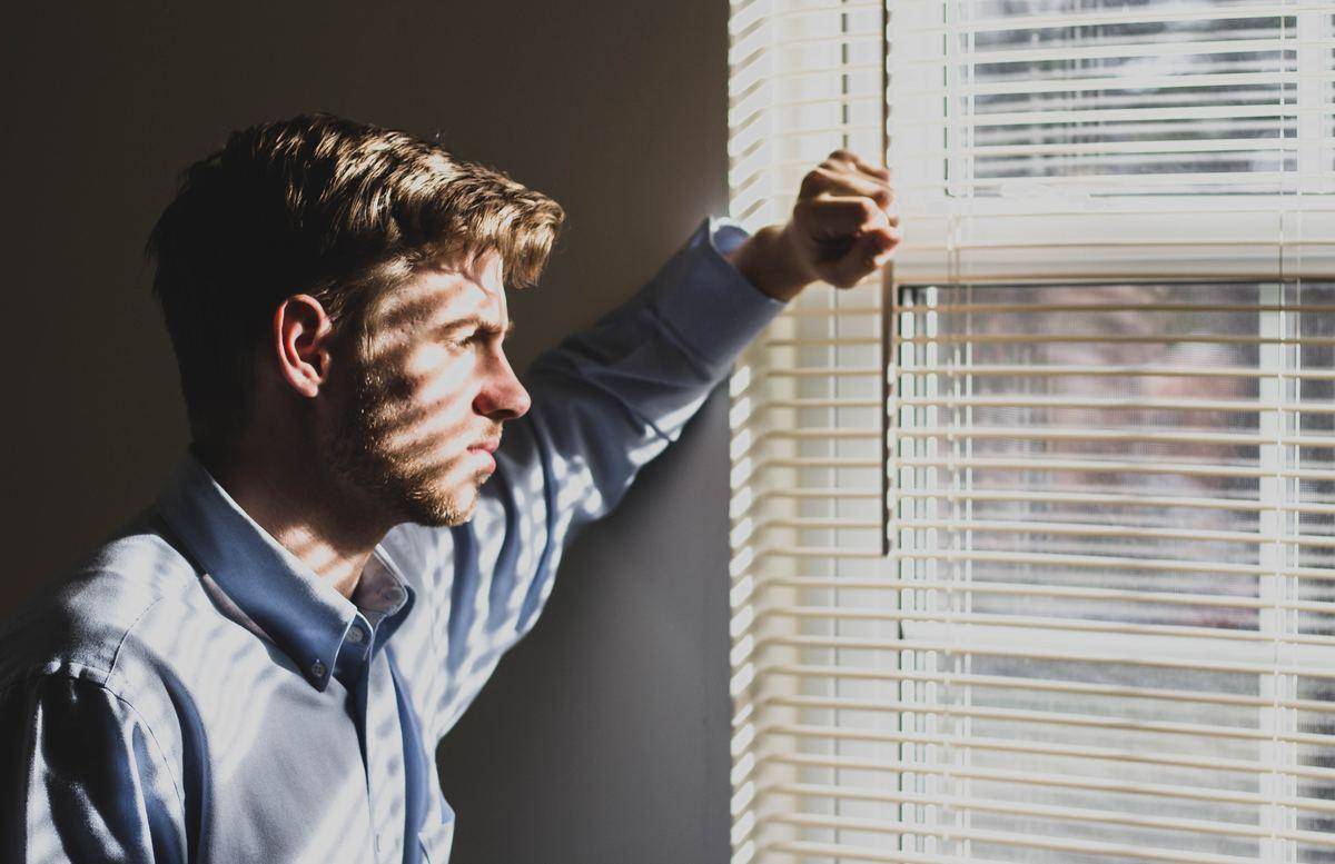 man near blinds