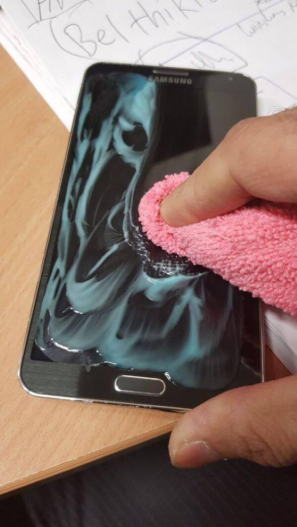 Toothpaste on phone screen.