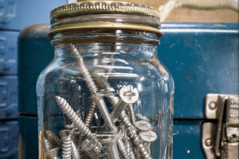 Screws in a mason jar.