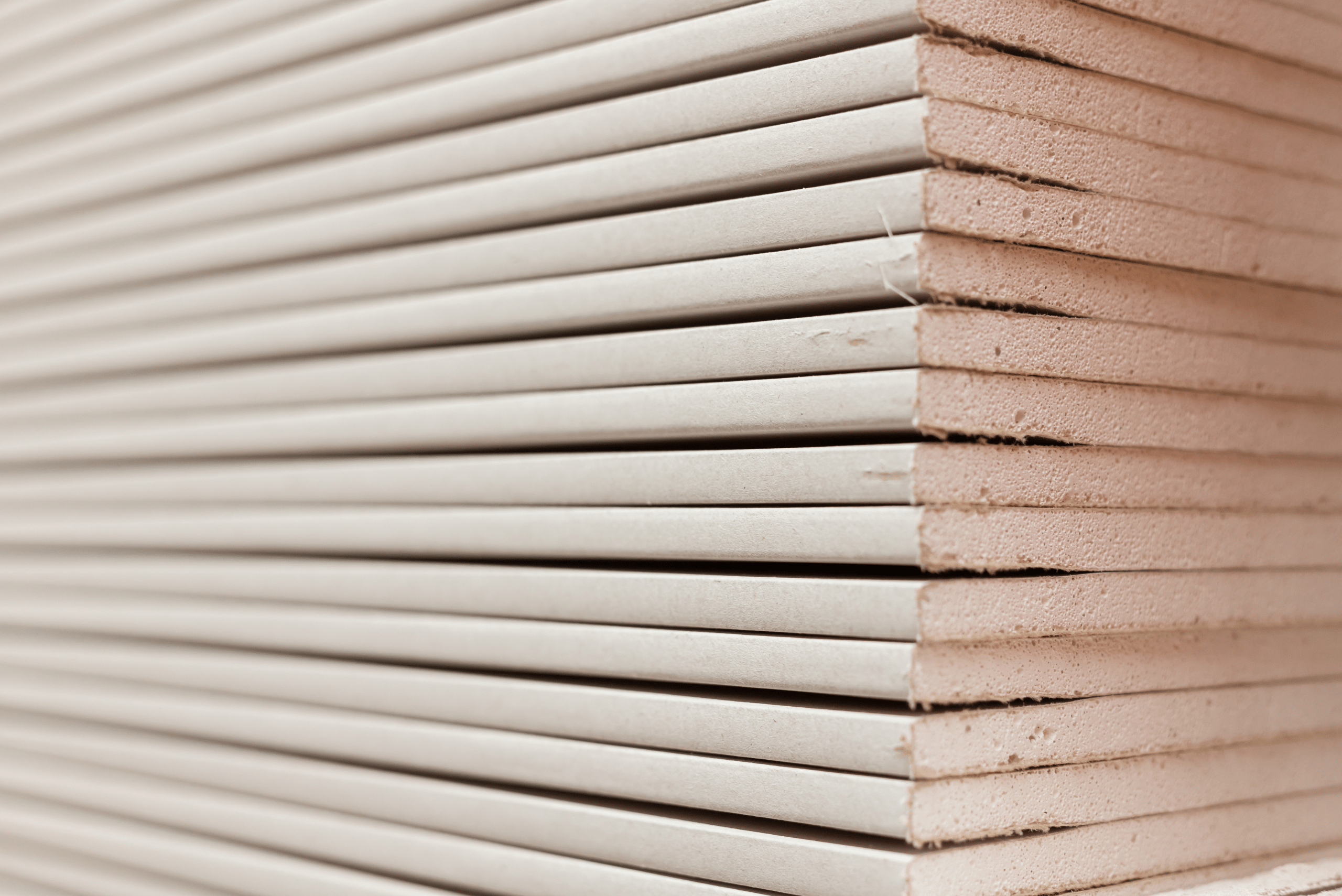 Stack of drywall sheets.