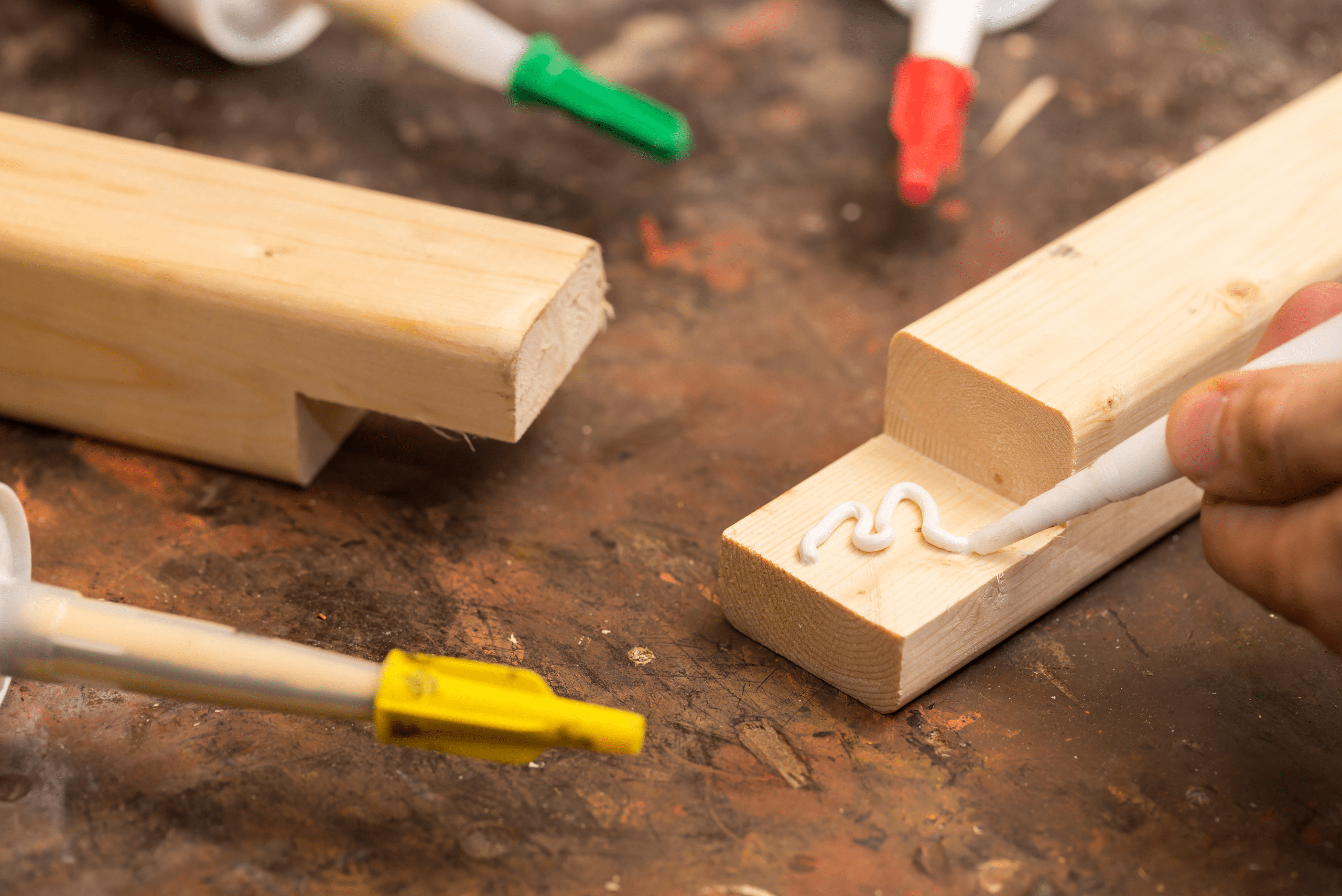 Gluing wooden chair legs.