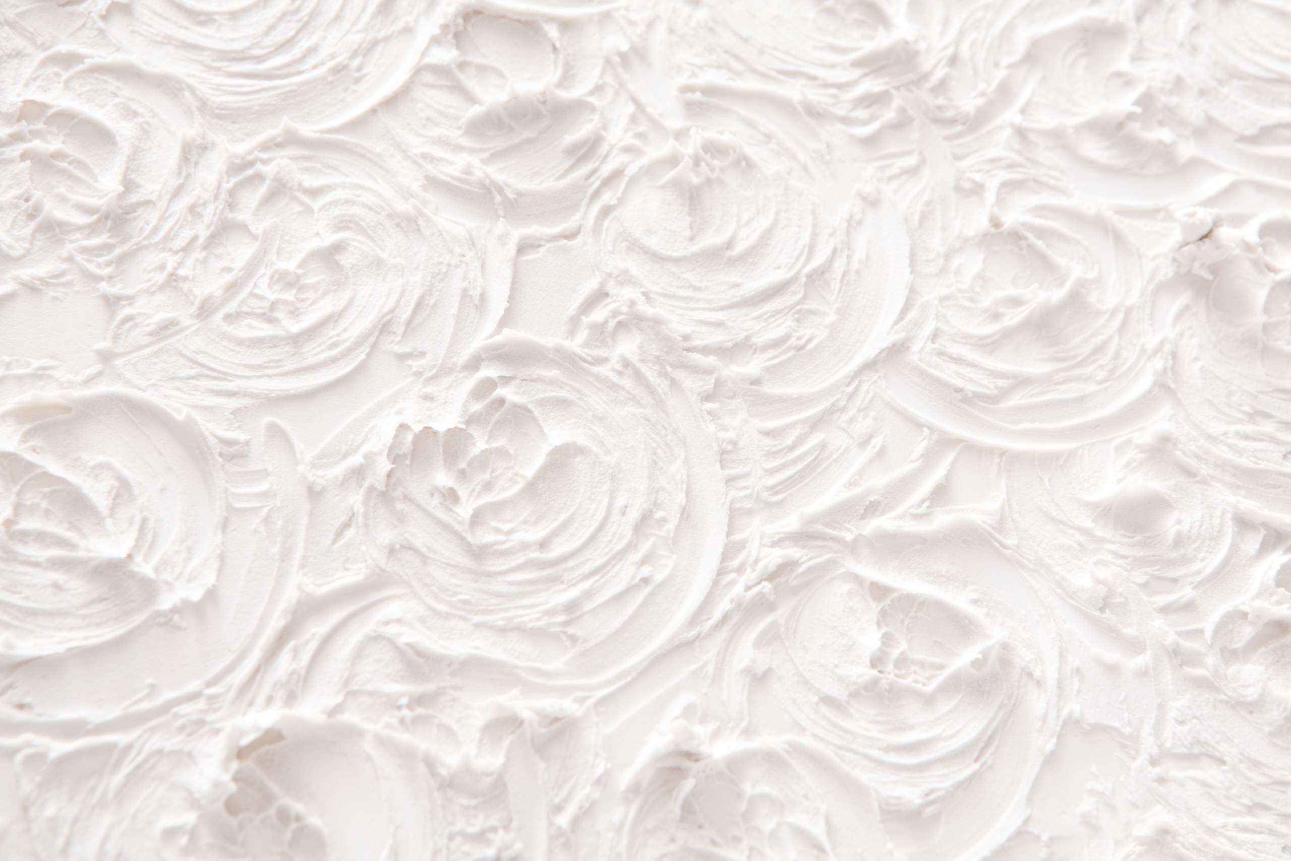 White plaster with swirl design.