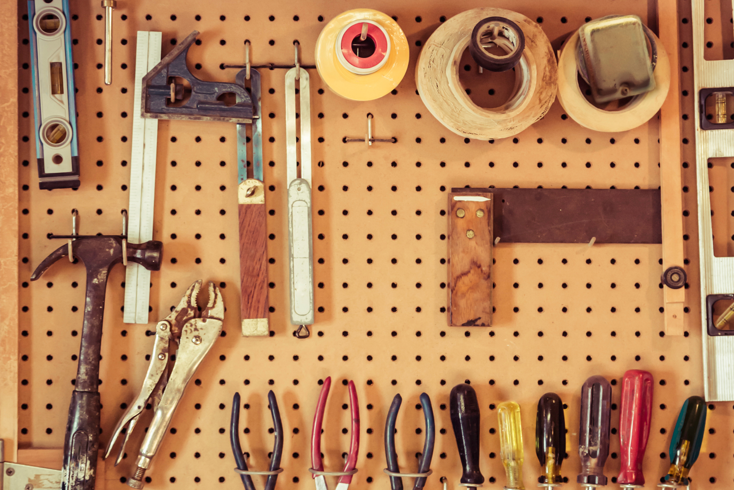 Pegboard with an assortment of tools.