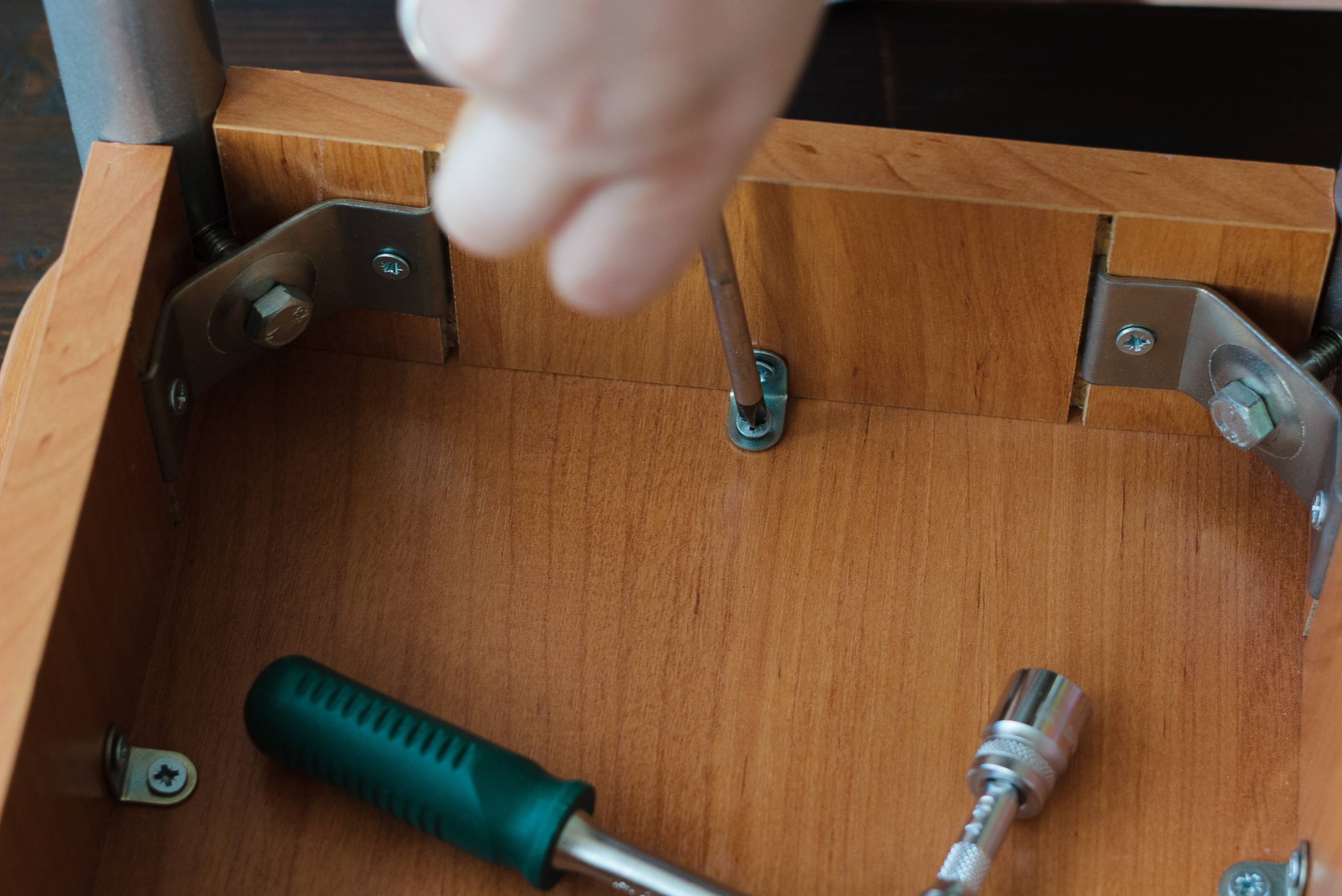 Tightening a chair screw.