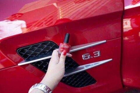 red nail polish next to a red car