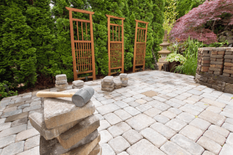 Concrete pavers with mallet on top.