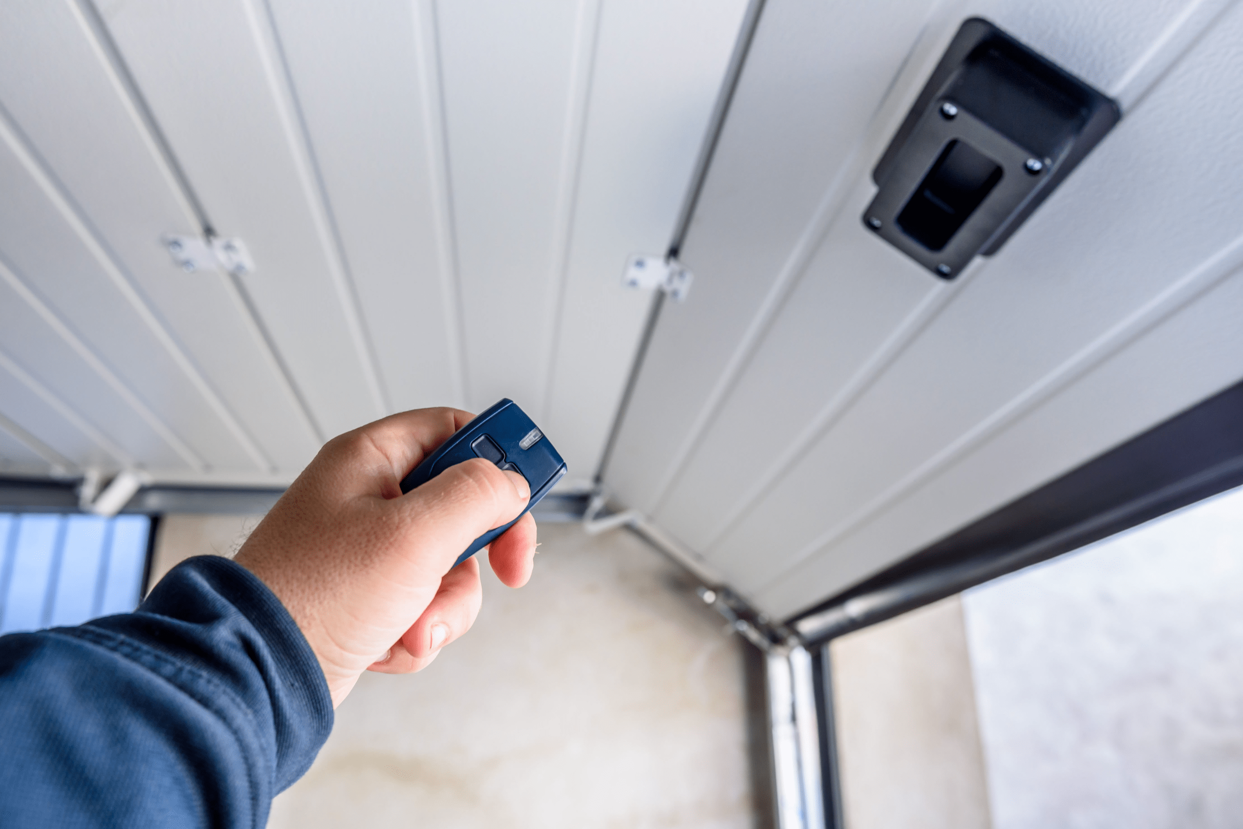 Garage door opener with door sliding up.