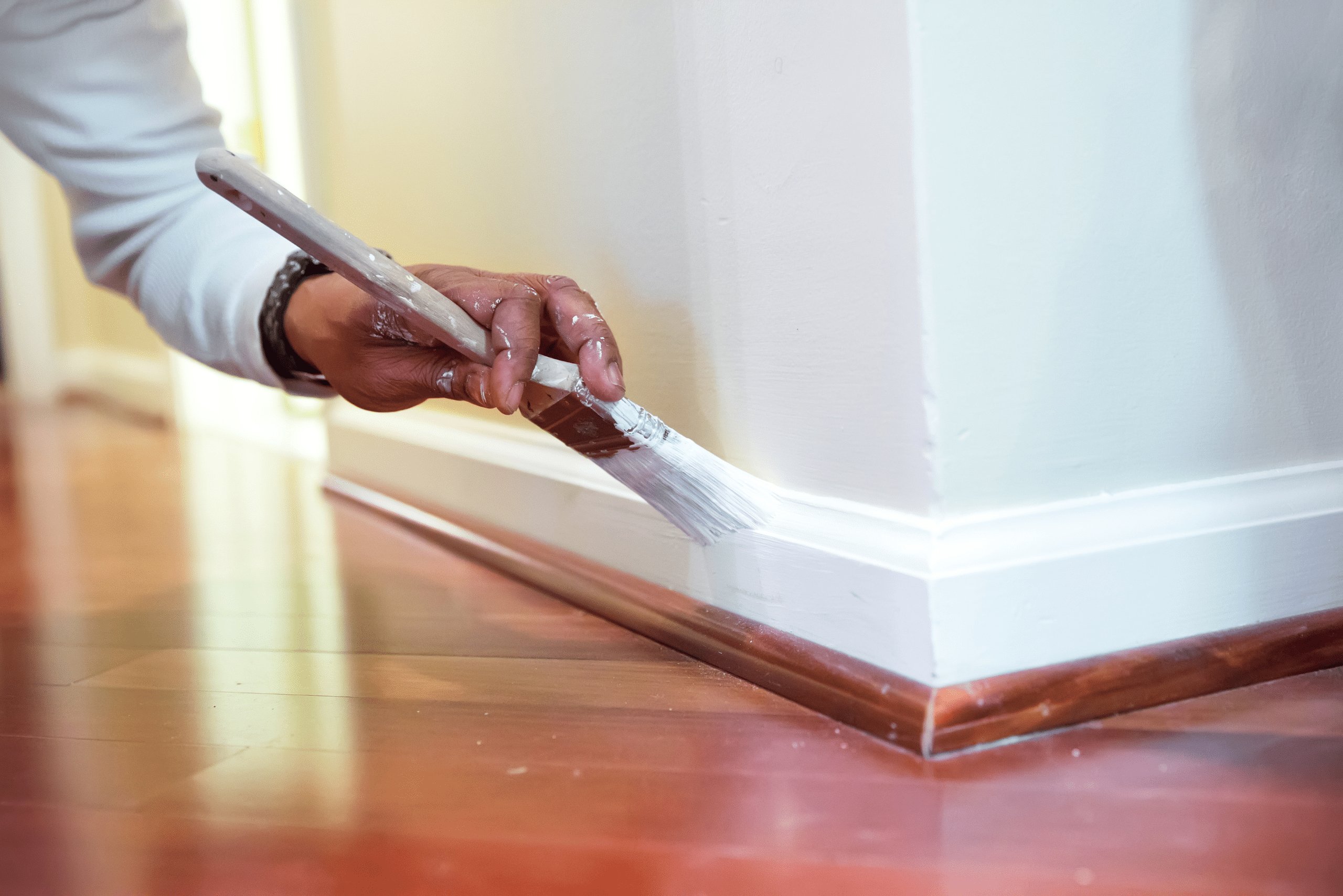 Painting baseboards white after installation 