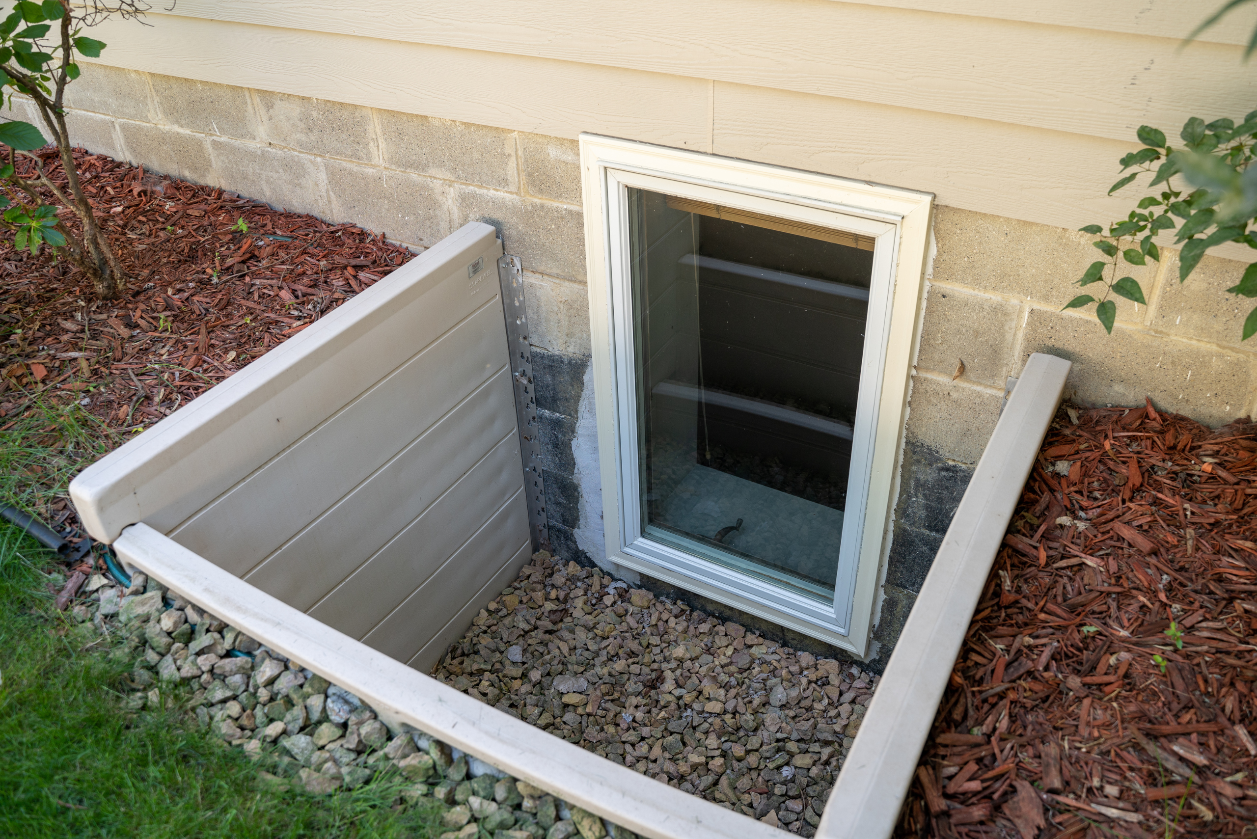 Basement window of a house.