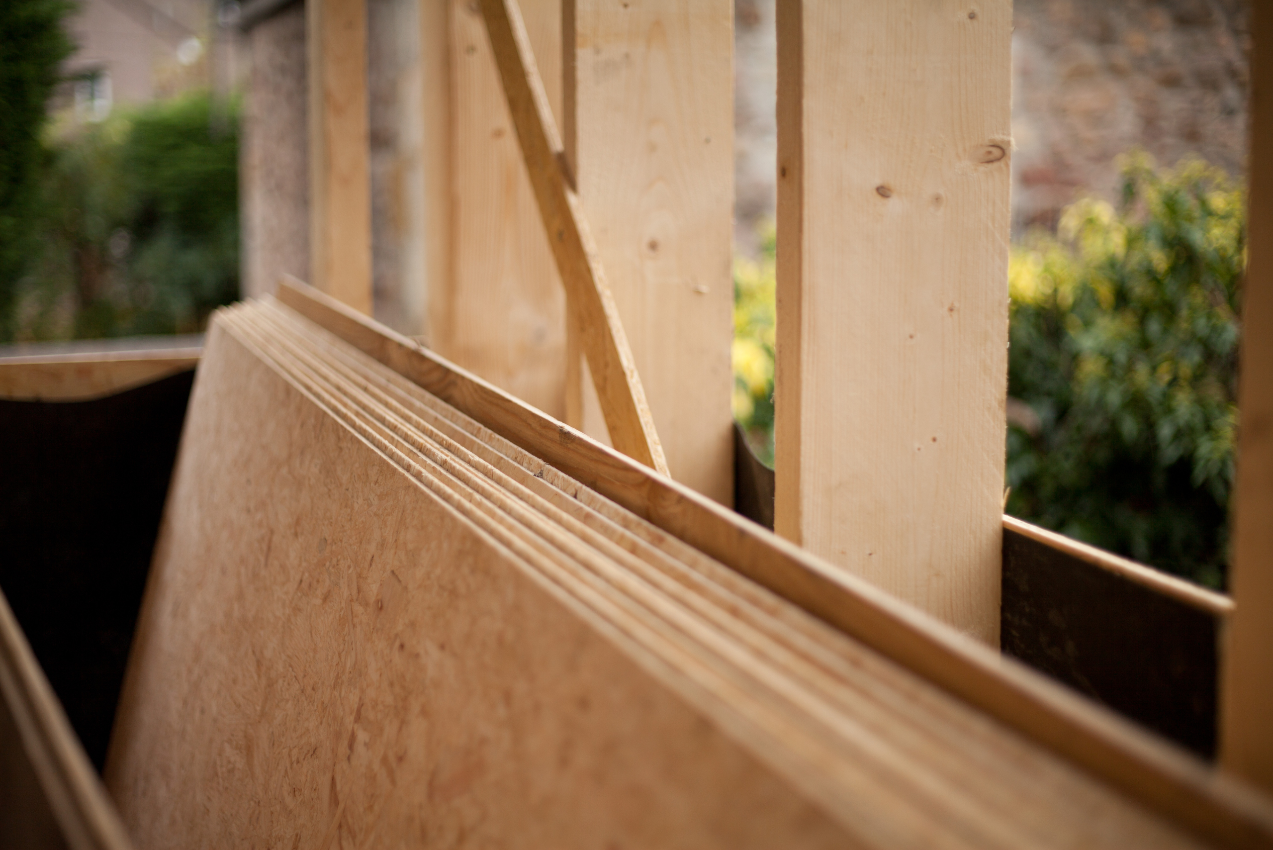 Plywood sheets in an unfinished building.