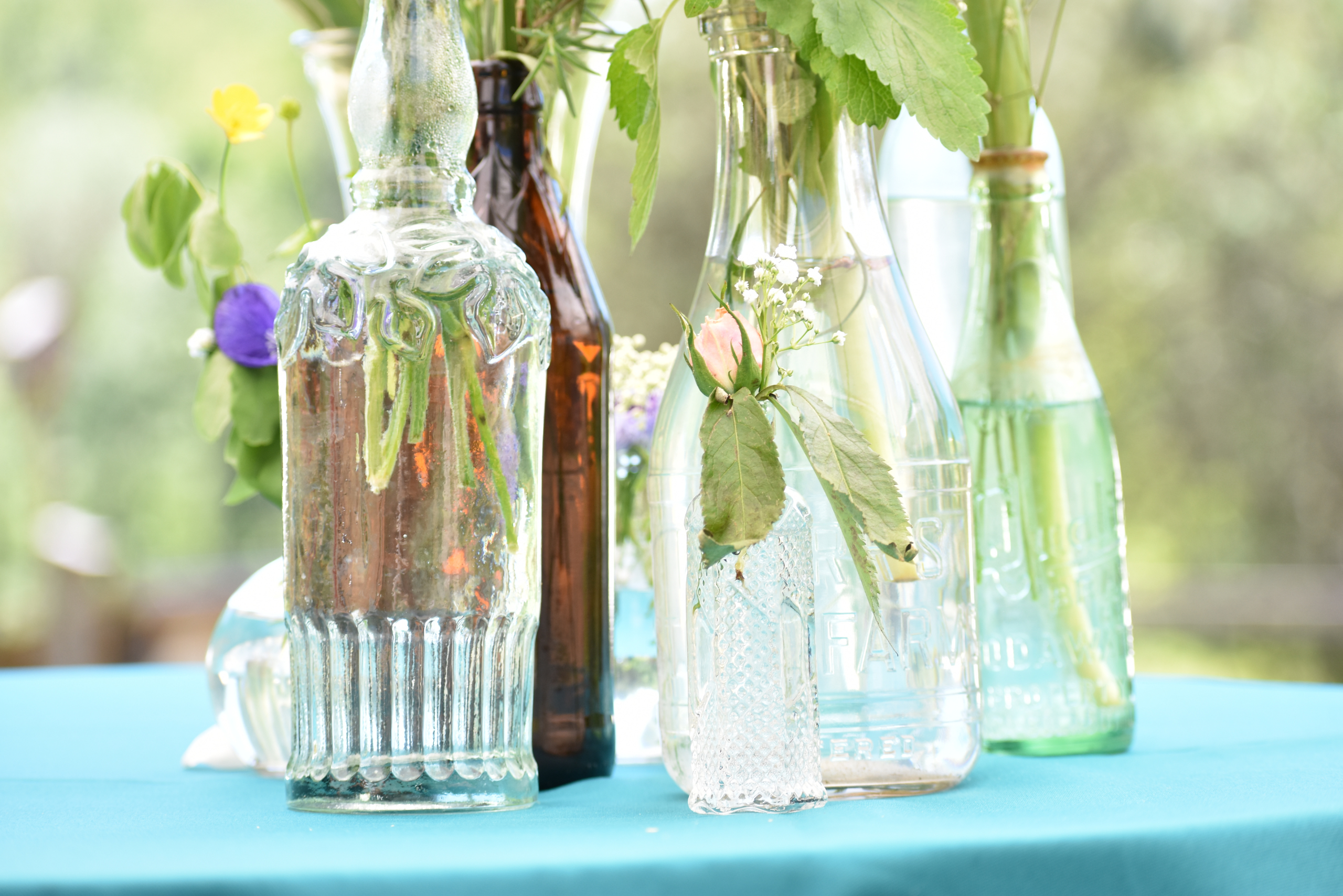 Glass bottles upcycled to vases.