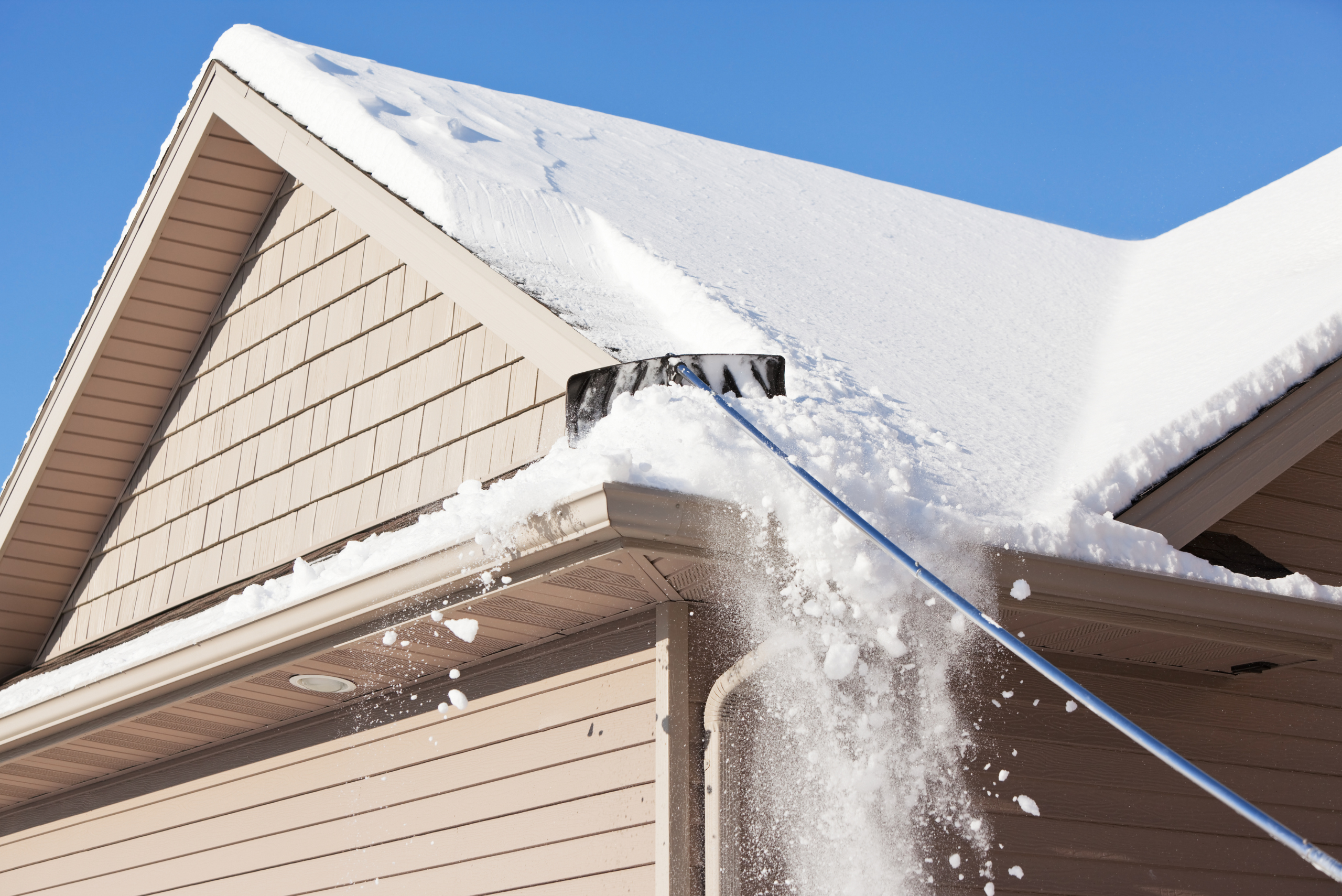 Pole used to bring snow down from roof.