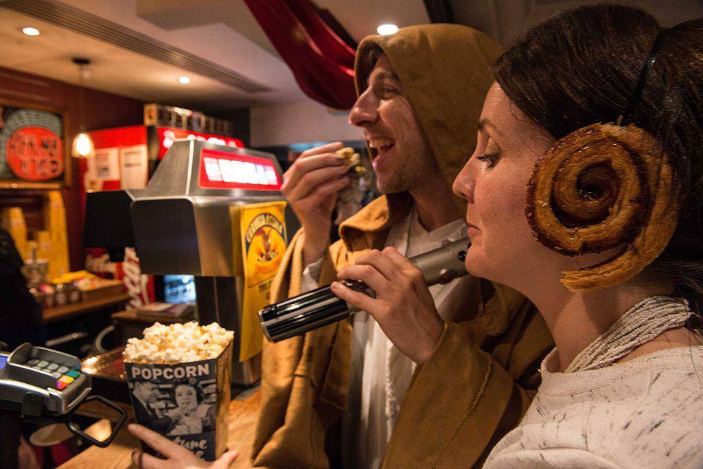 People eating popcorn.