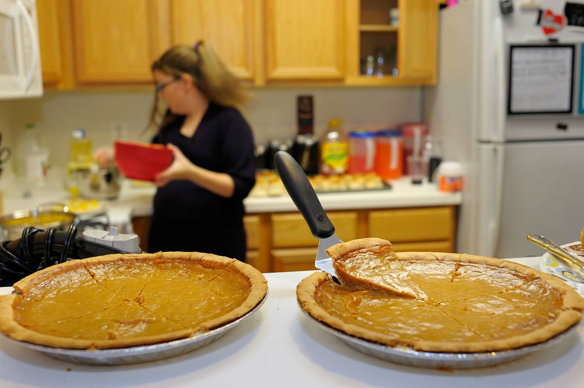 Two pumpkin pies sit on the kitchen counter as Mary Ann Jones wife of a US Marine, prepares a dish.