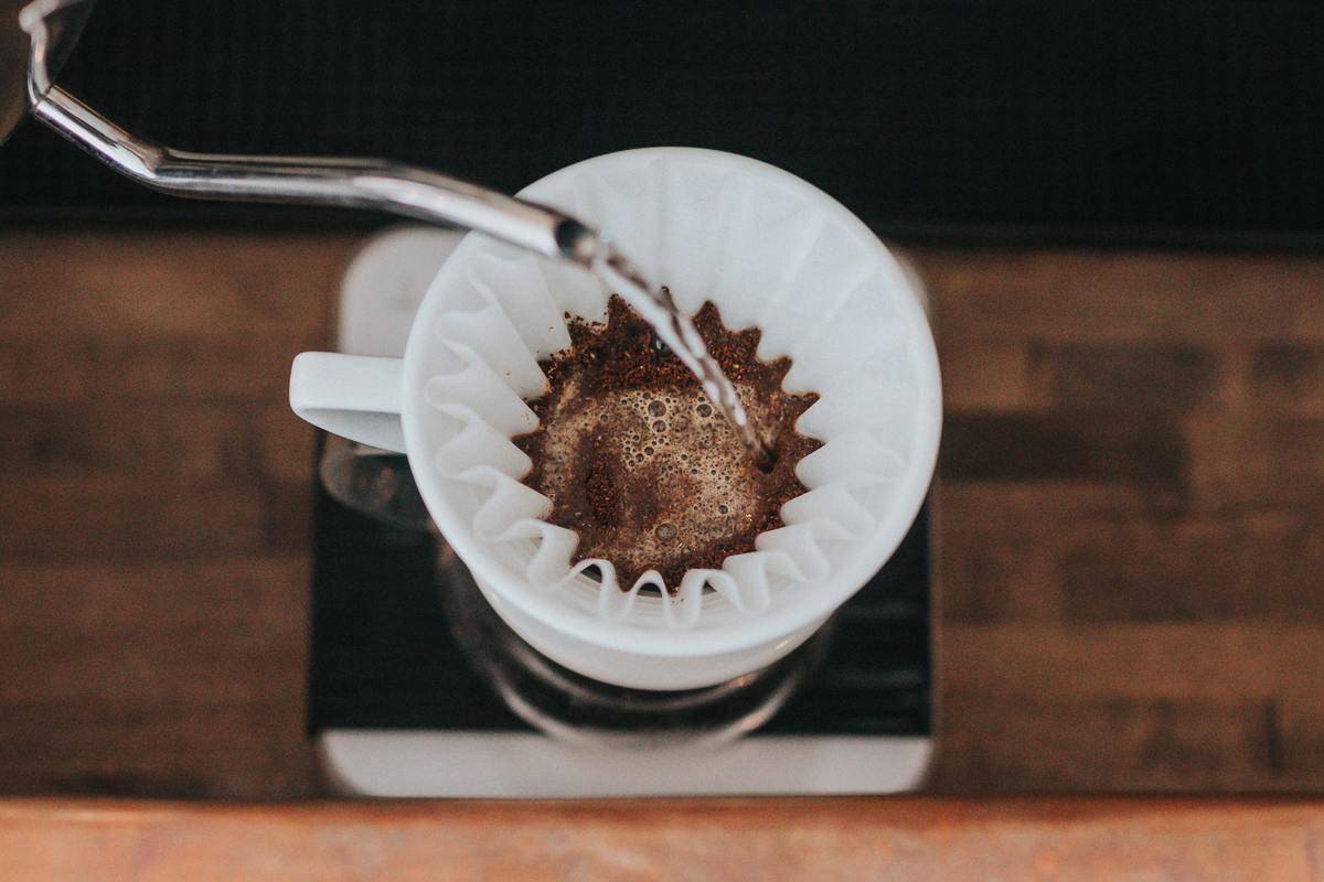 Water poured over coffee filter.