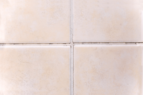 Cracked grout in bathroom.