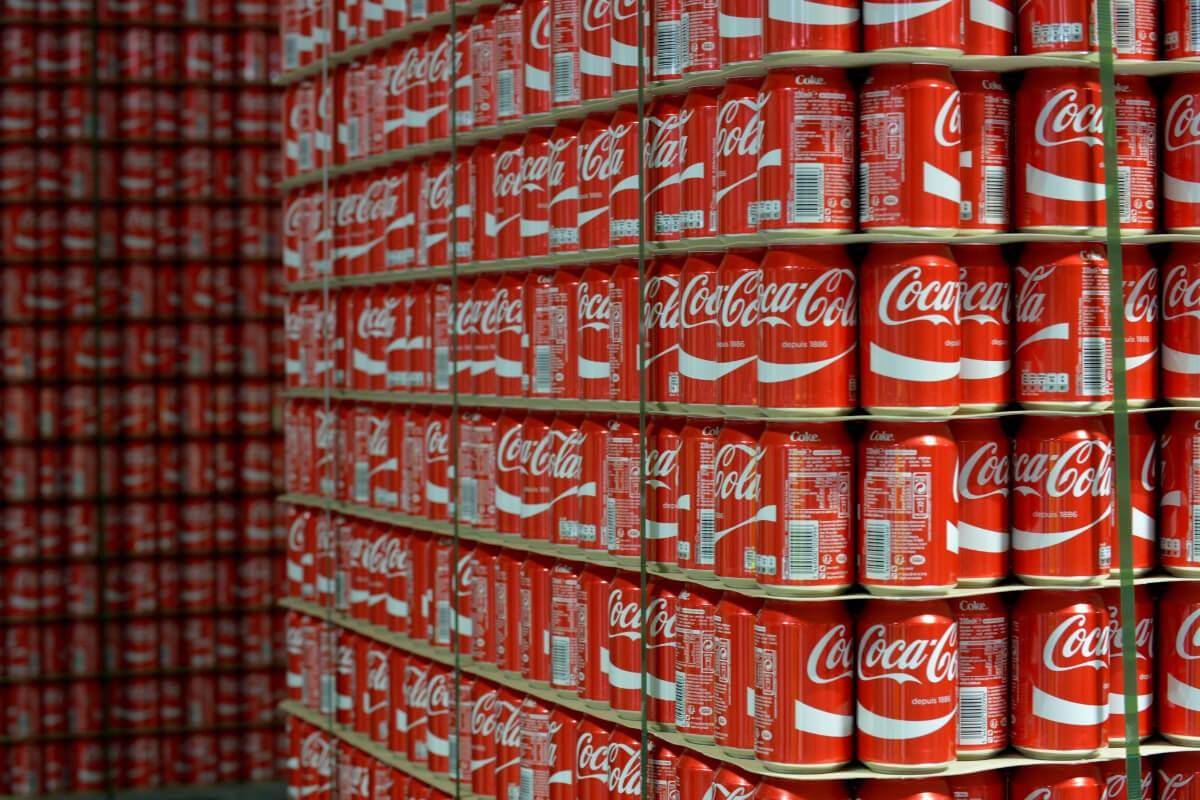 Stacks of Coca Cola cans.