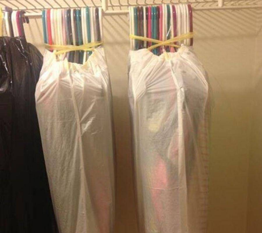 groups of hangers covered and held together by garbage bags