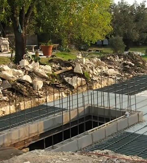 Iron rebar coming out of concrete bunker being built.