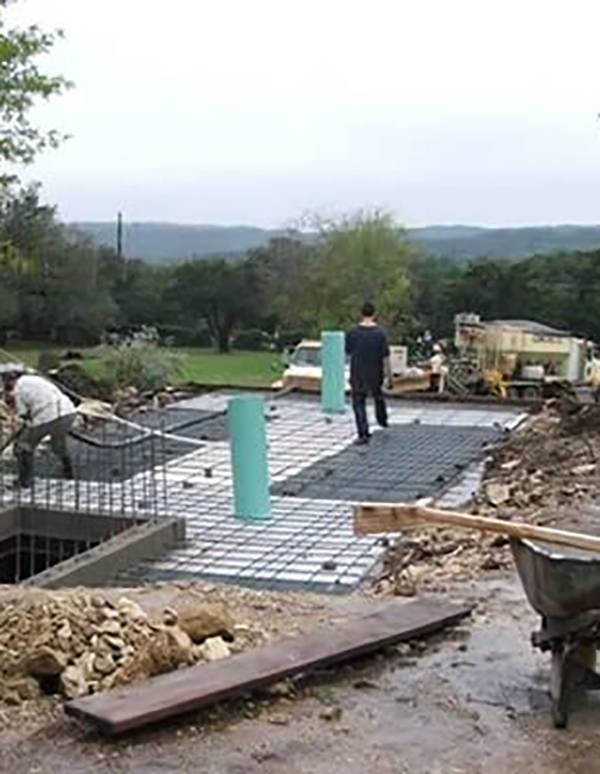 Iron rebar coming out of concrete bunker being built.