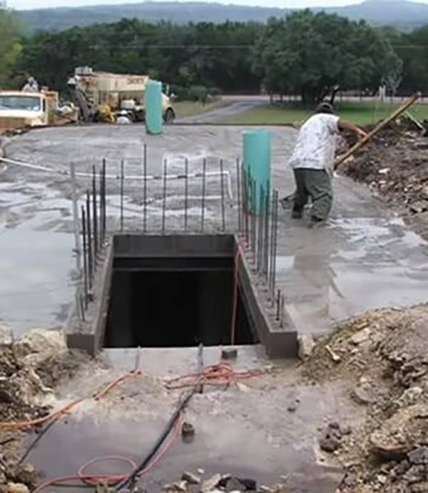 Iron rebar coming out of concrete bunker being built.