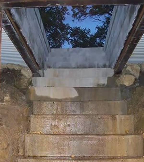 Concrete stairs covered in light mud.