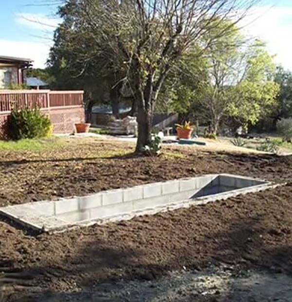 Concrete structure in dirt.