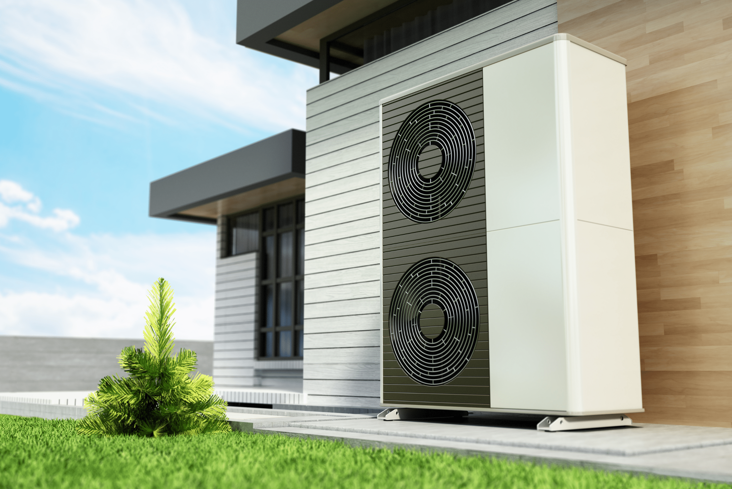 Large heat pump units on the side of a house.