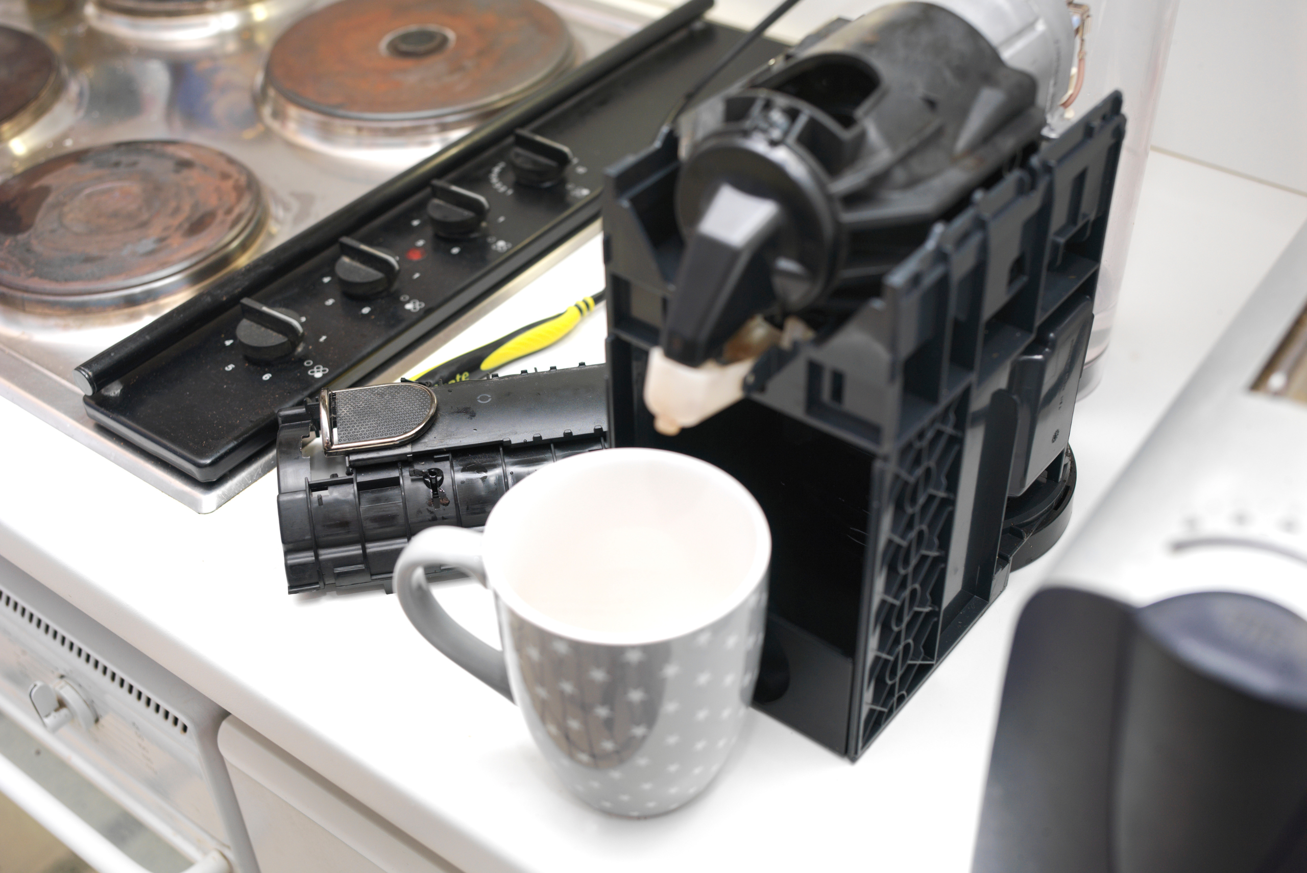 Coffee maker taken apart for cleaning.