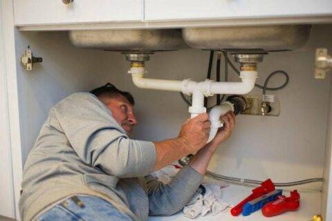 Plumber working.