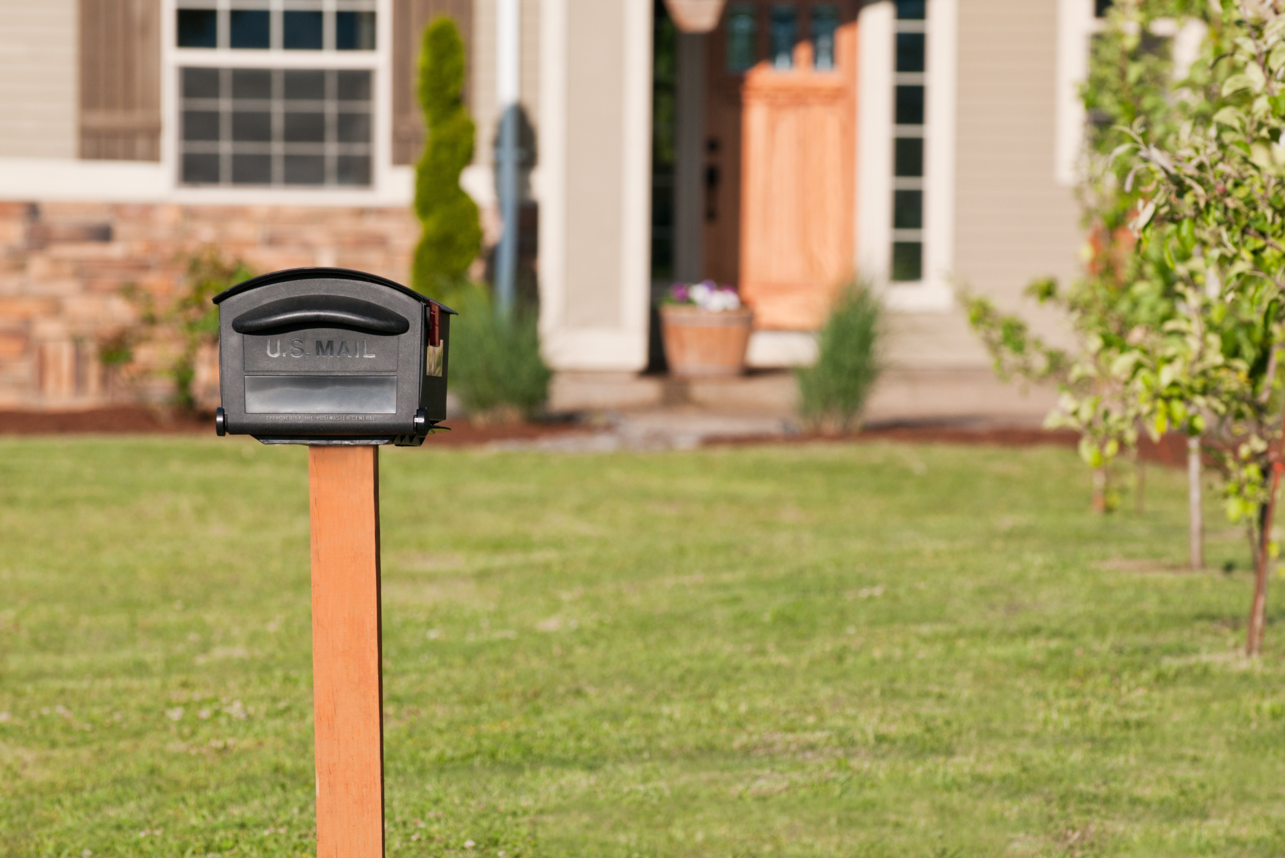 New mailbox in front of a house.