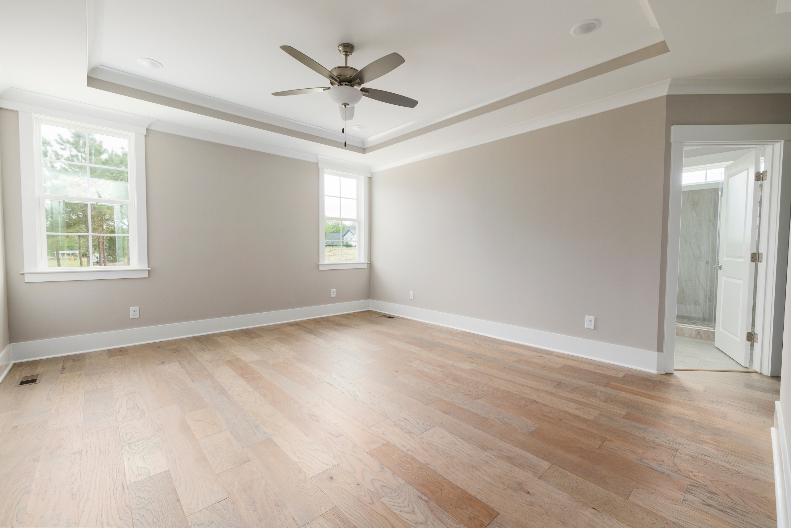 Empty room with a ceiling fan.