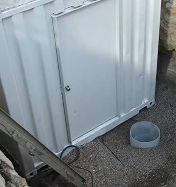 White metal containers with door.