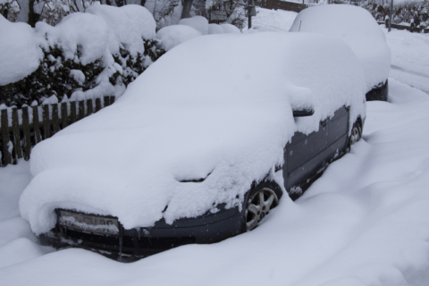 Car covered in snow.