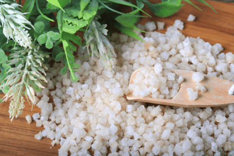 Epsom salt with wooden spoon.