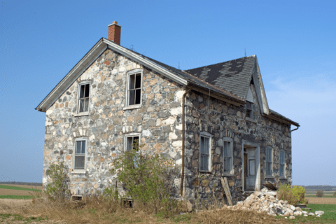 Exterior of a house with stone facade.