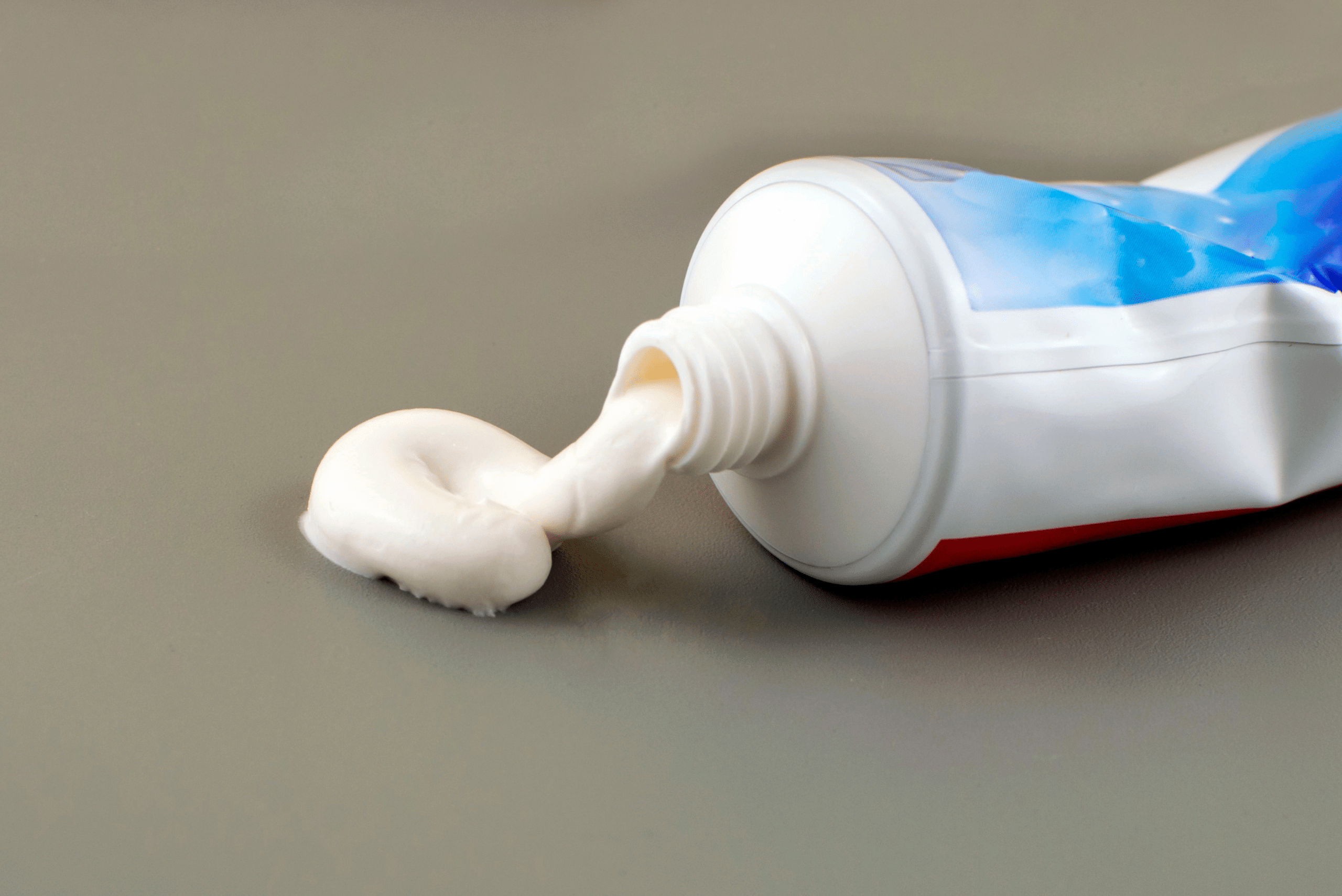 Toothpaste tube open leaking.